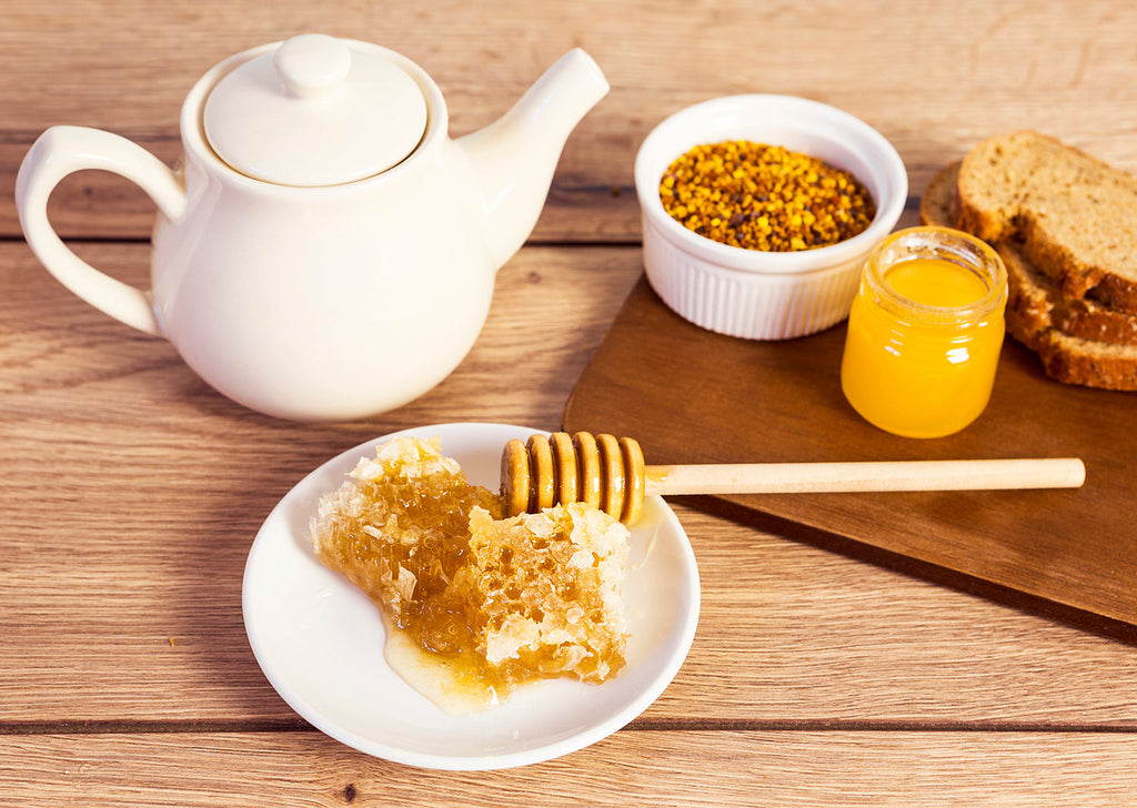 Wooden honeycomb shaped honey dipper.