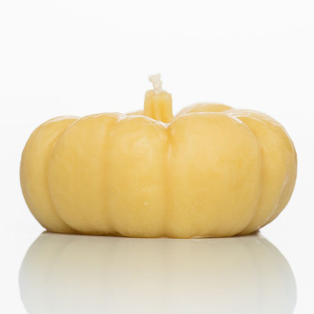 Pumpkin-shaped beeswax candle.