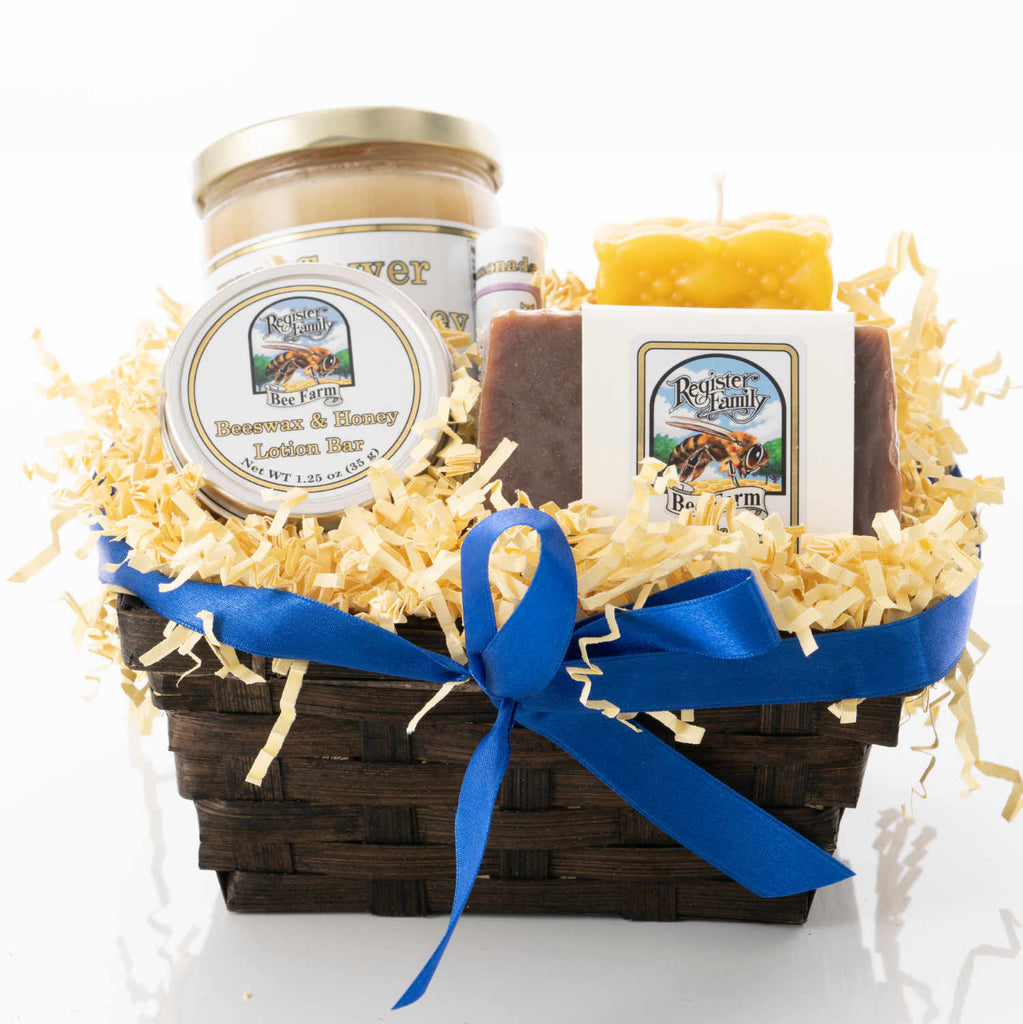 Small gift basket of creamed honey, beeswax candles, and other beeswax products