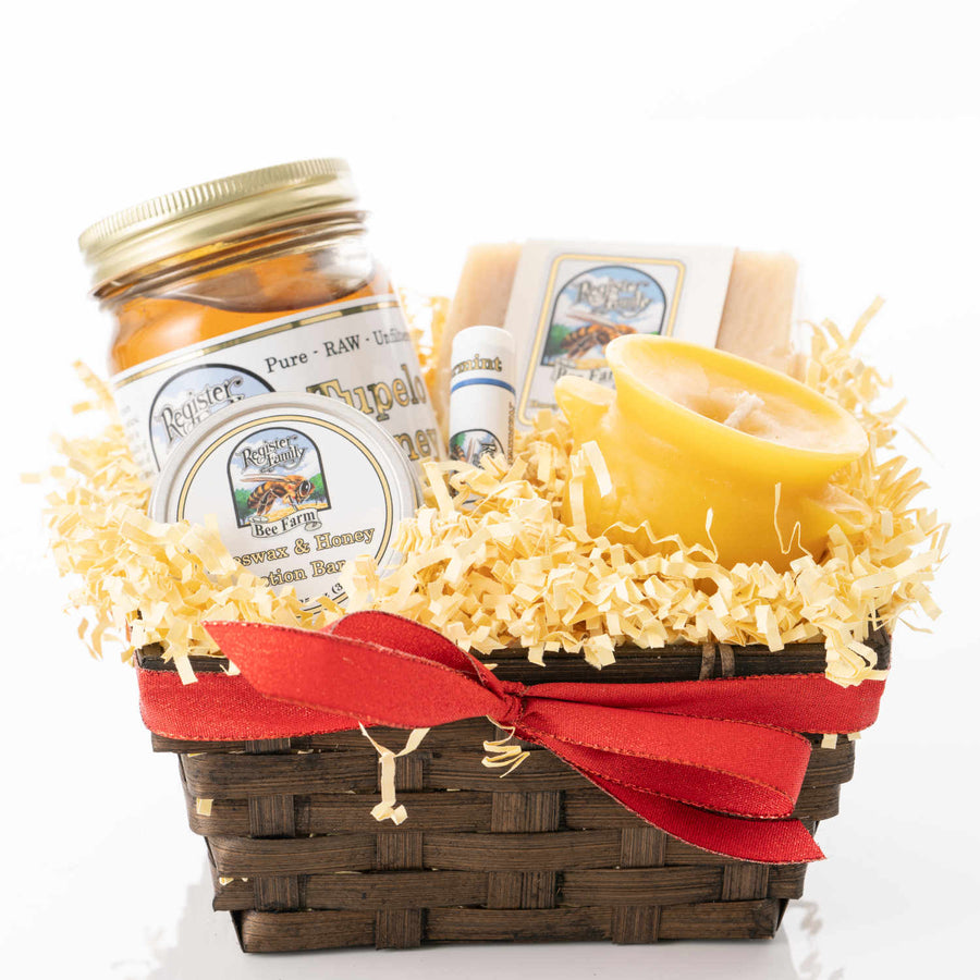 Small gift basket of honey, beeswax candles, and other beeswax products