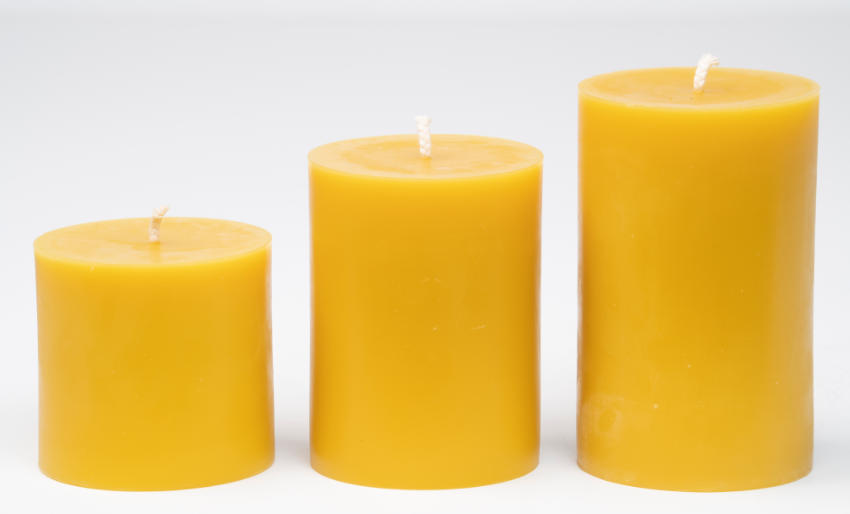 three sizes of beeswax pillar candles 